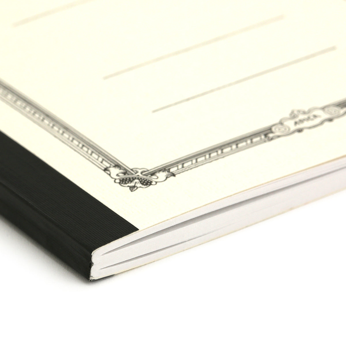 end view of the white notebook showing the sections and binding