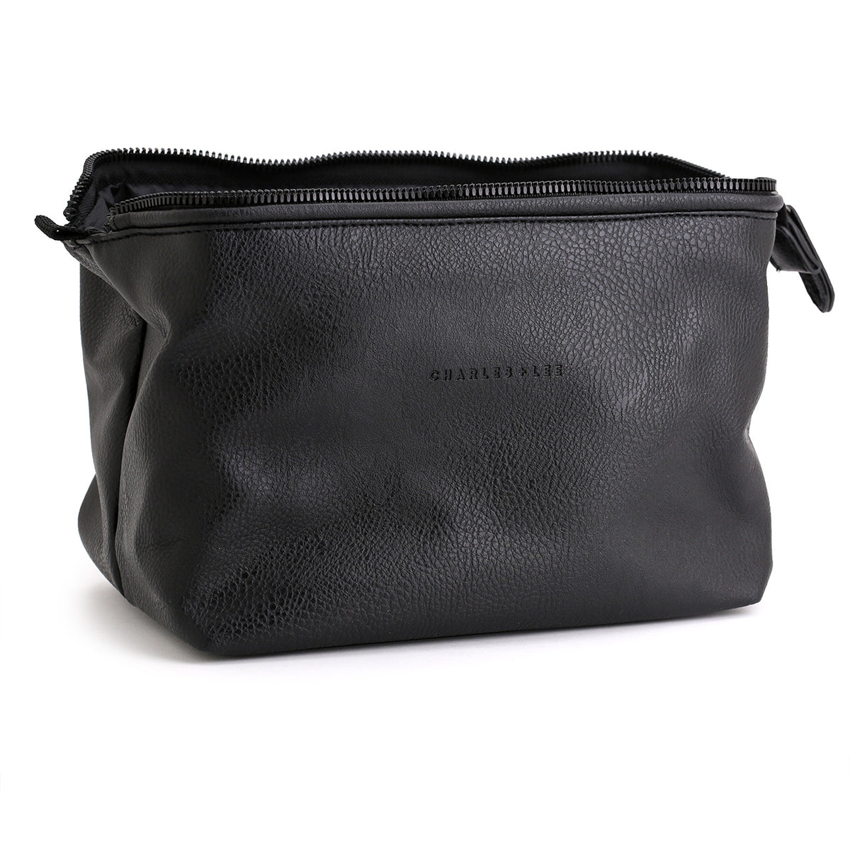 Charles and Lee black toiletry bag opened to show the full height and structured wire and zipper closure