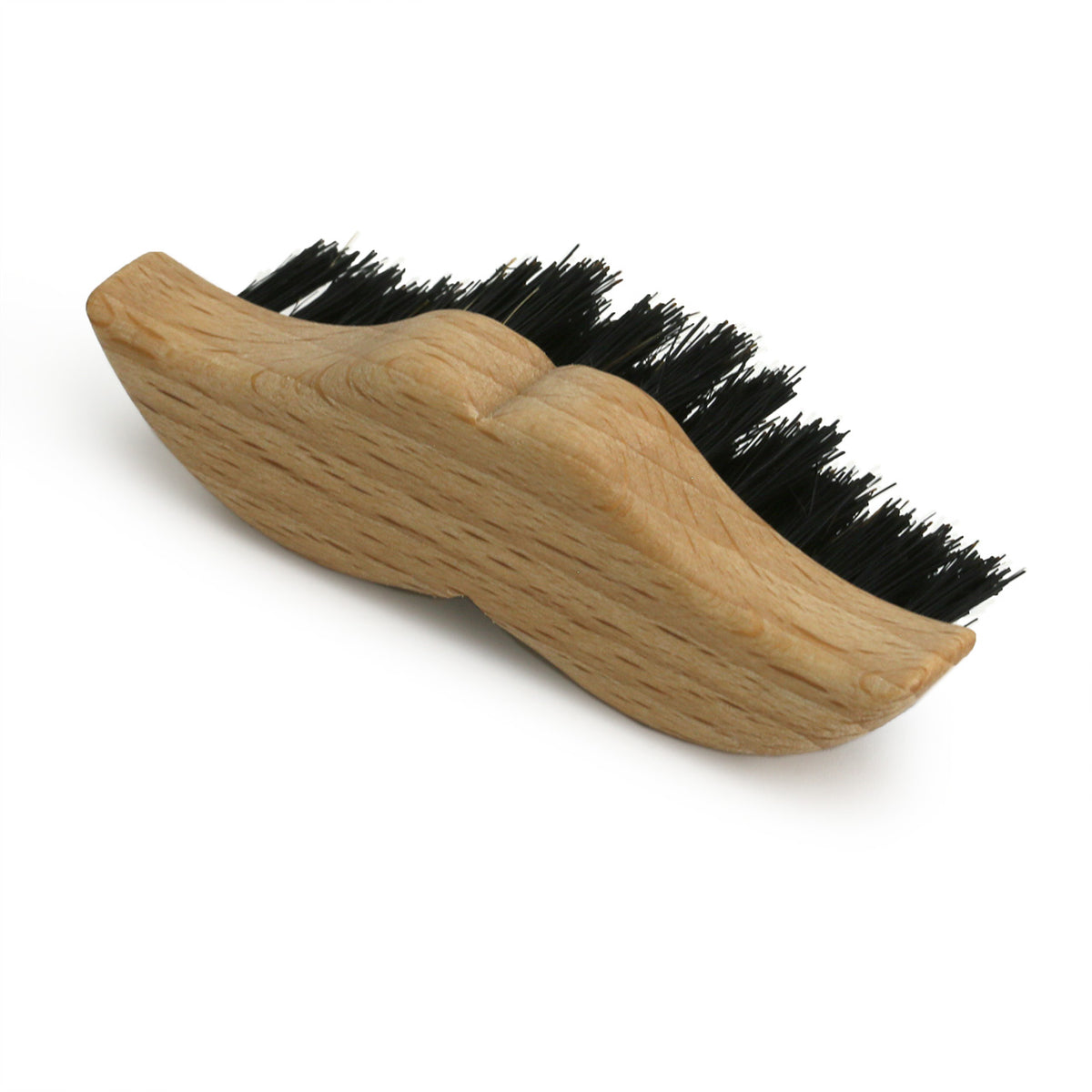 wooden Moustache brush in  the shape of a moustache, three-quarter angle from above showing the length of the stiff bristles