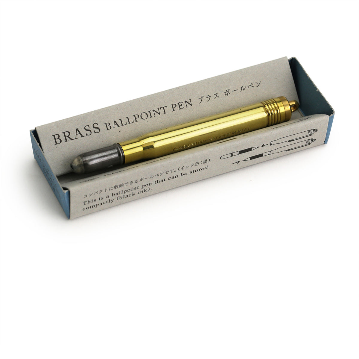 Brass ballpoint pen in its kraft packaging