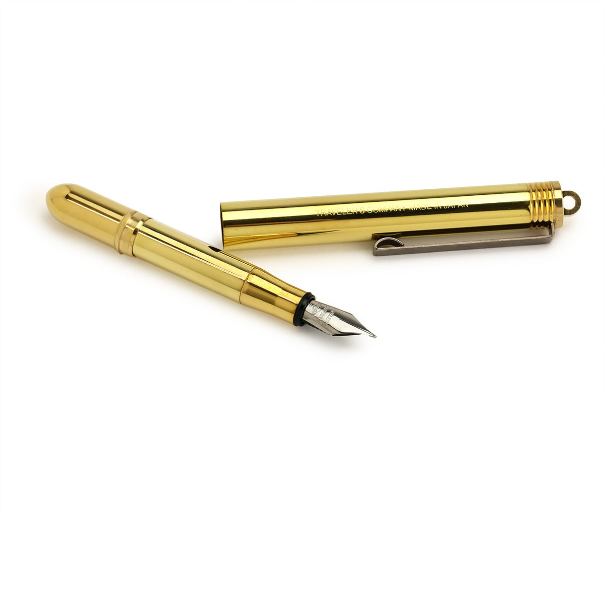 disassembled brass fountain pen whhere both pieces are similar length, fountain pen end and long cap end which posts onto the pen