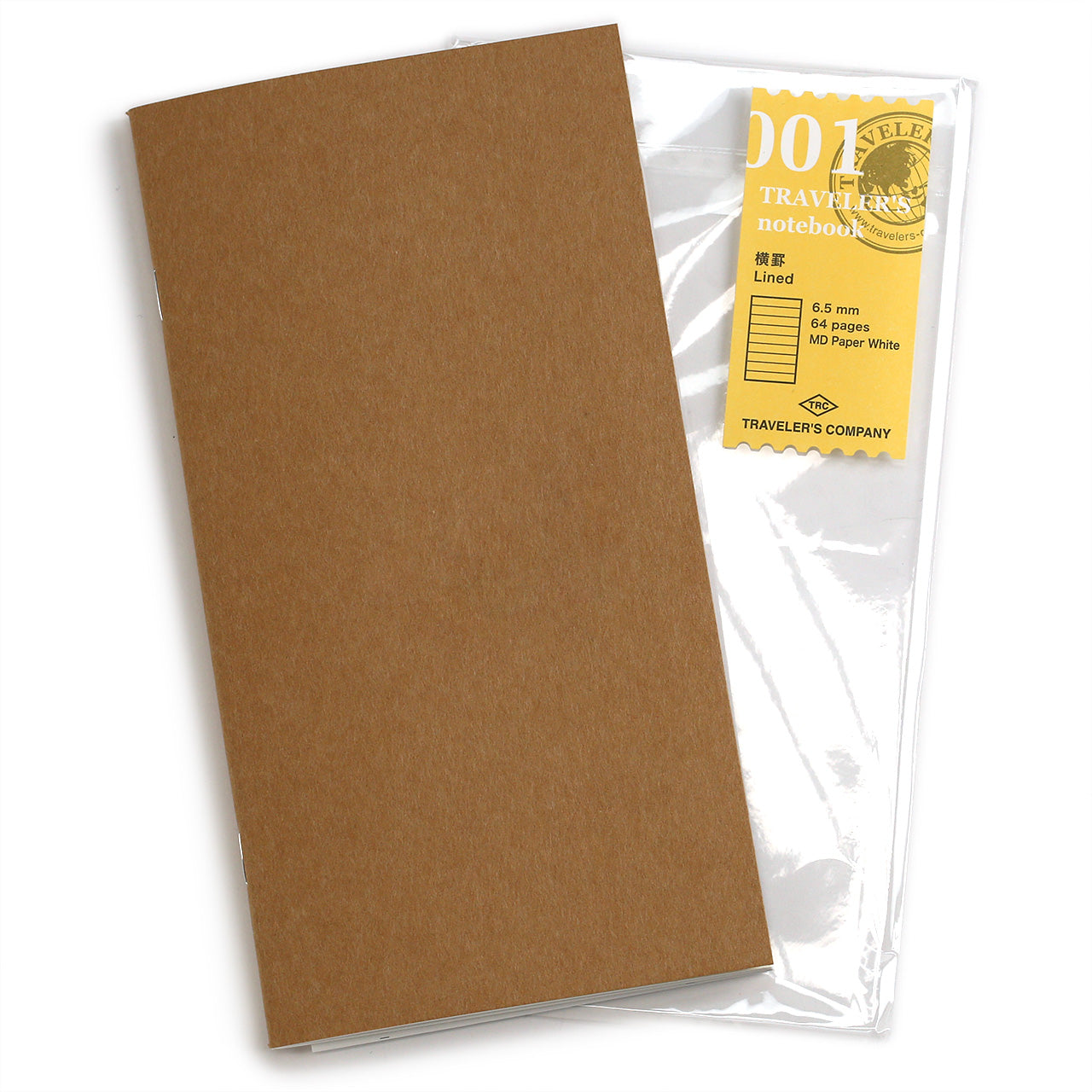 Traveler's notebook 001 lined MD paper refill, showing the kraft cover and the yellow label