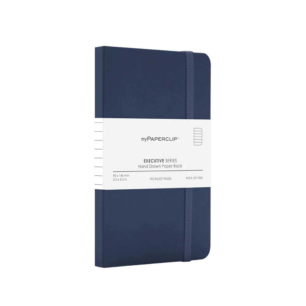 Navy blue notebook with a white label on a light gray background