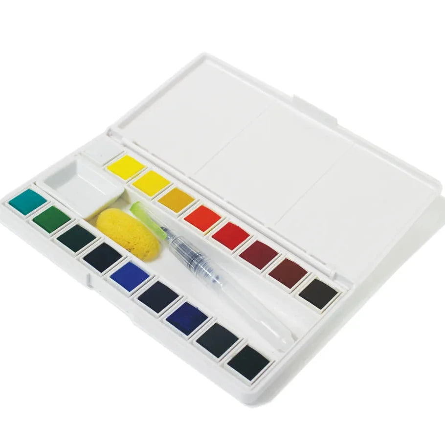 Watercolor paint set with a variety of colors on a white background