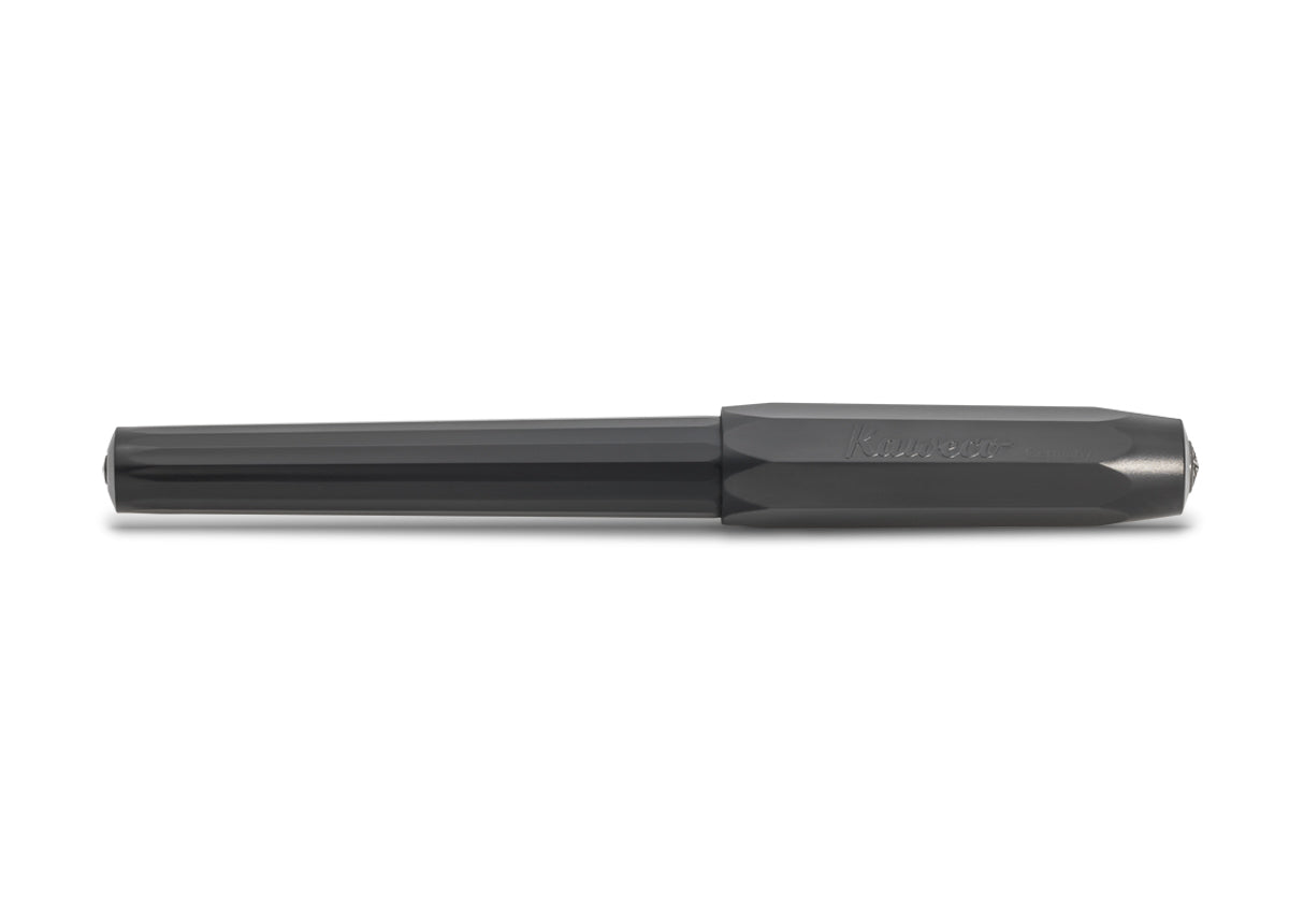 Side view of the closed all-black pen shows the faceted barrel and less-faceted cap