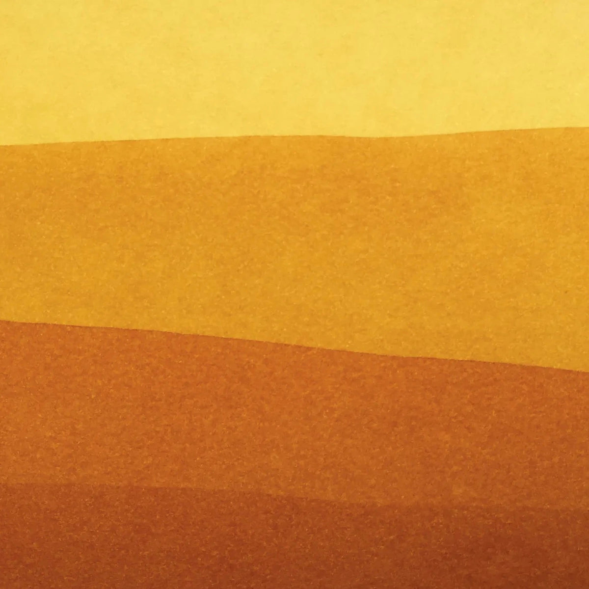 Gradient of yellow to brown on a textured fabric background