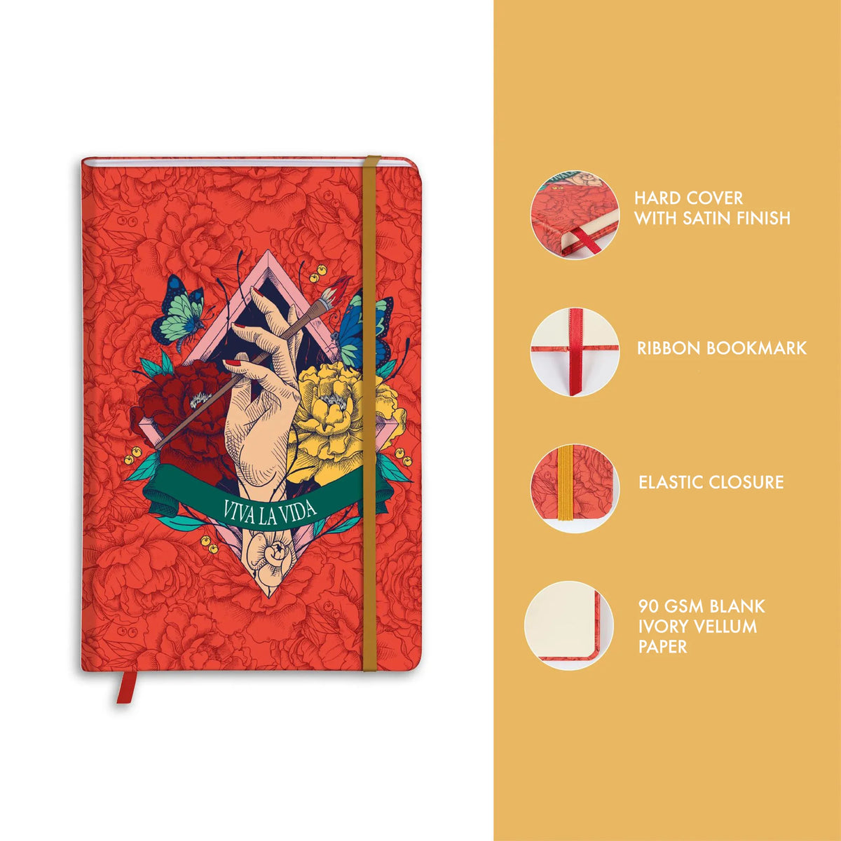 Red notebook with artistic design on cover, featuring a ribbon bookmark and elastic closure on a yellow background.