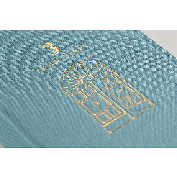 Gold stamped cover detail of the light blue diary