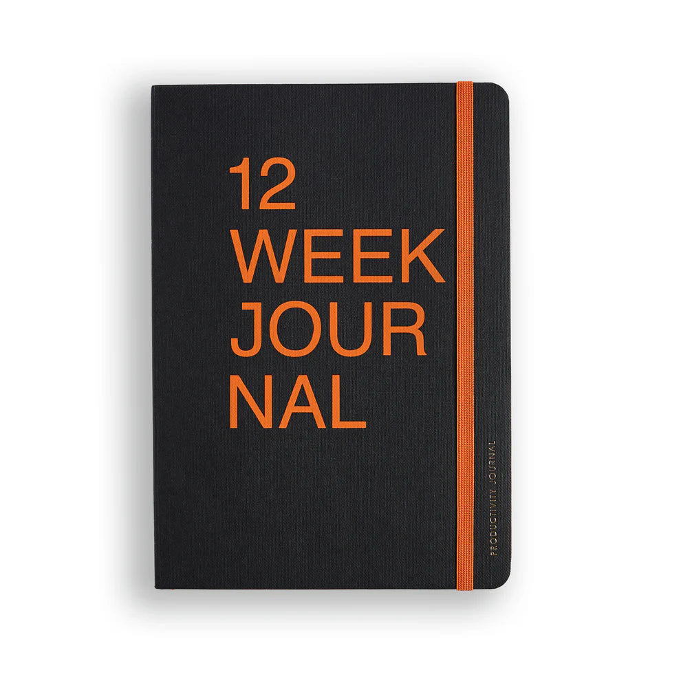 Black journal with orange text on a white background