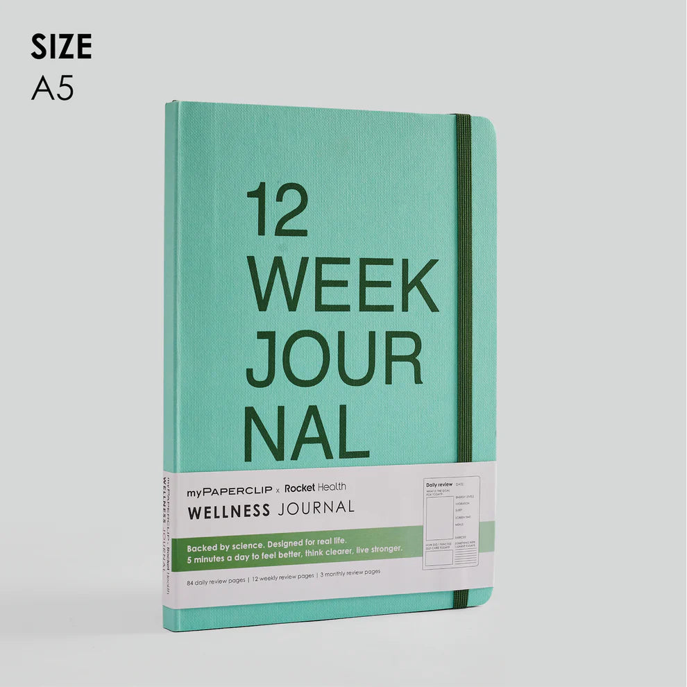 Turquoise journal with '12 Week Journal' text on a light gray background