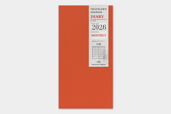 Orange diary with &#39;Traveler&#39;s Company&#39; branding on a white background