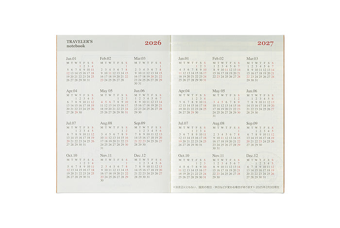 Open calendar notebook showing pages for 2026 and 2027 on a white background