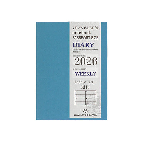 Blue diary with white label on a light gray background