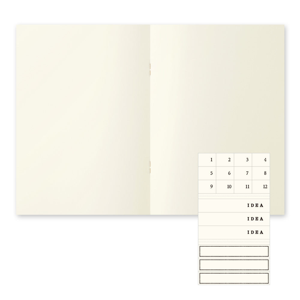 Inside spread of the lined notebook shows the lay flat, cream paper and labelling slip