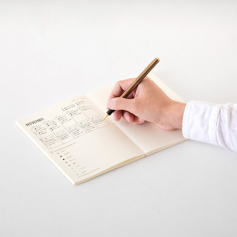 An open Dot notebook being used for a sketching, grid drawing and notes