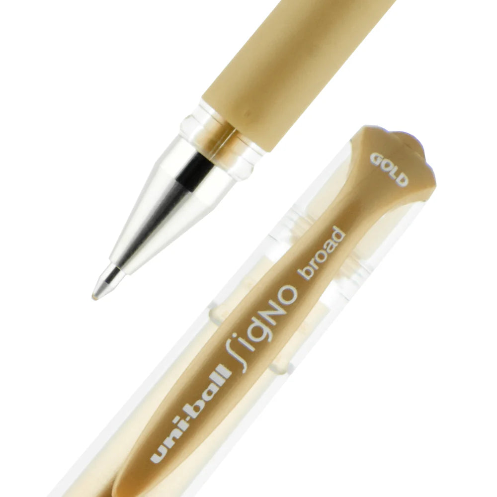 Gold pen with cap on a white background