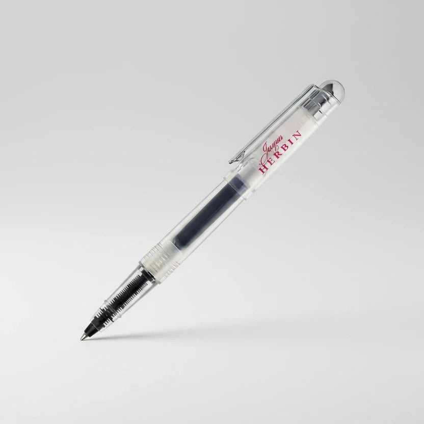 Clear pen with red text on a white background