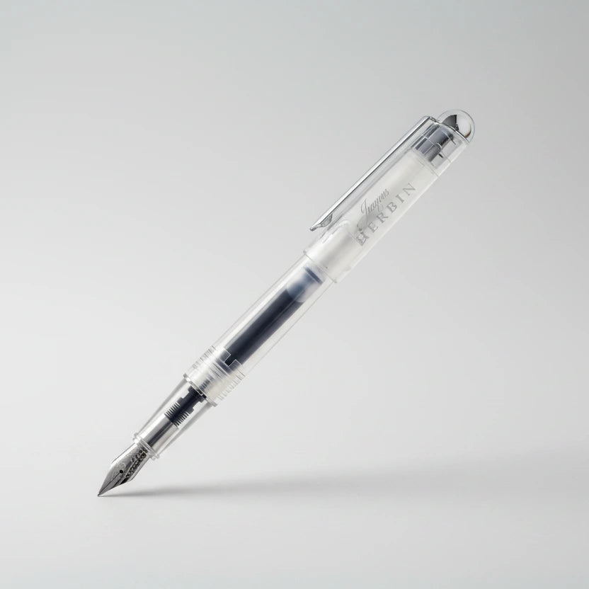 Transparent pen with black ink on a white background