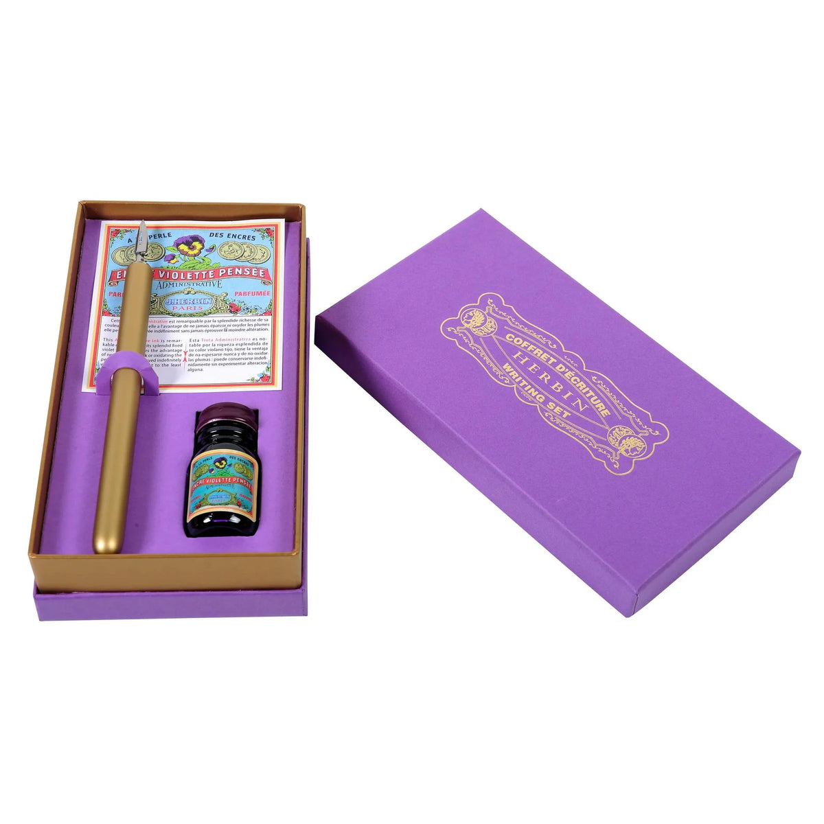 Purple gift box with a gold pen and bottle of ink on a white background
