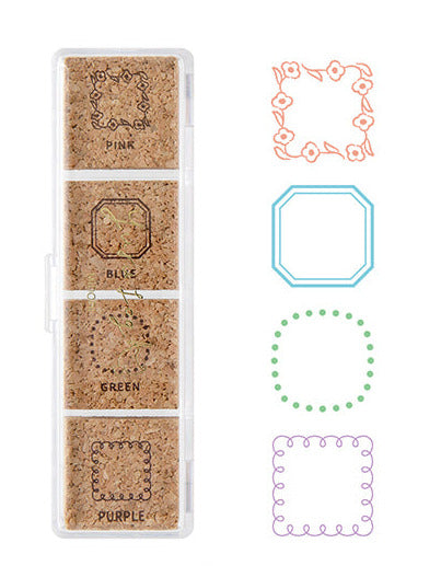 Set of four cork coasters with decorative frames in pink, blue, green, and purple on a white background.
