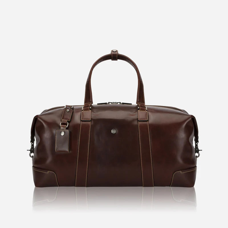 Brown leather duffel bag on a white background