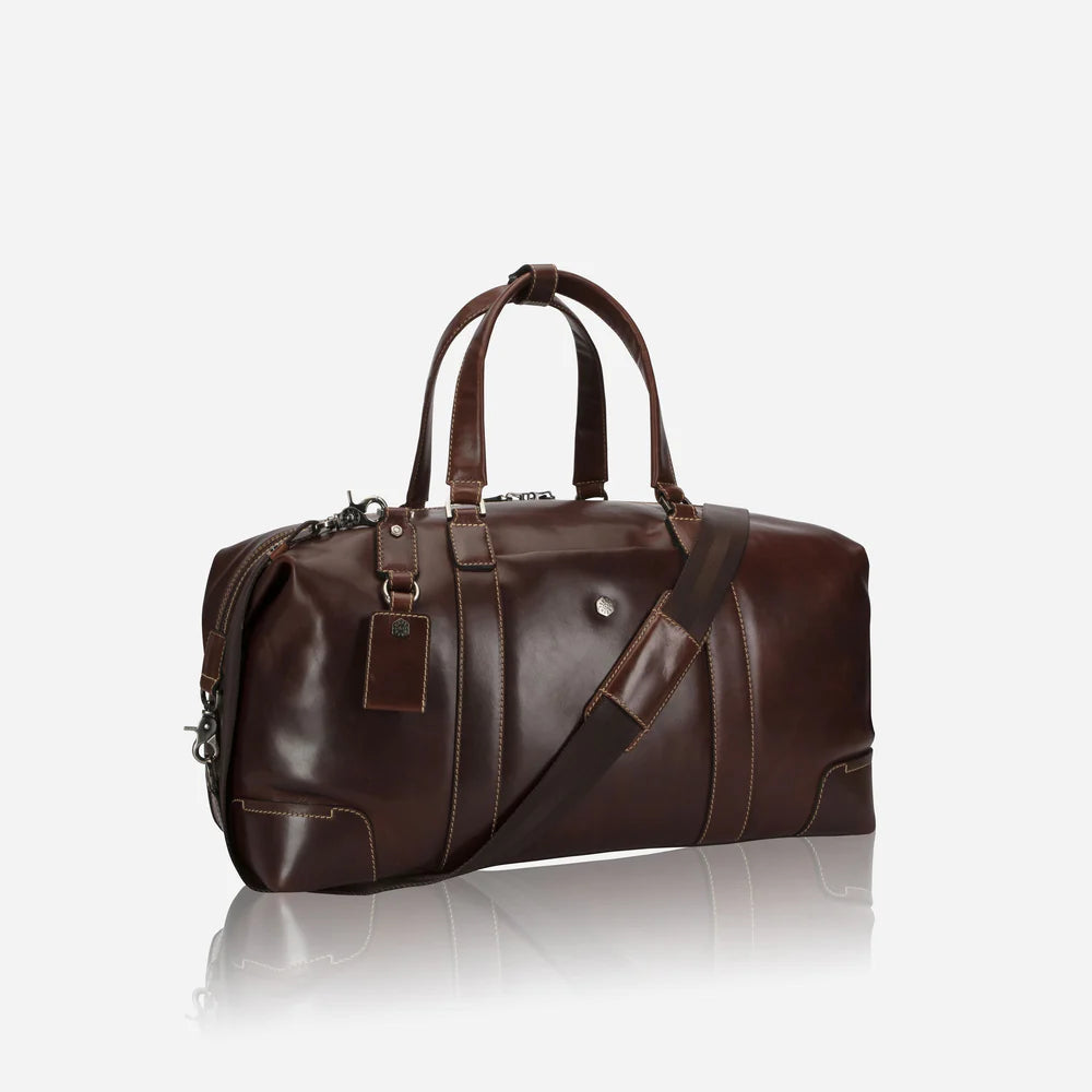 Brown leather duffel bag on a white background