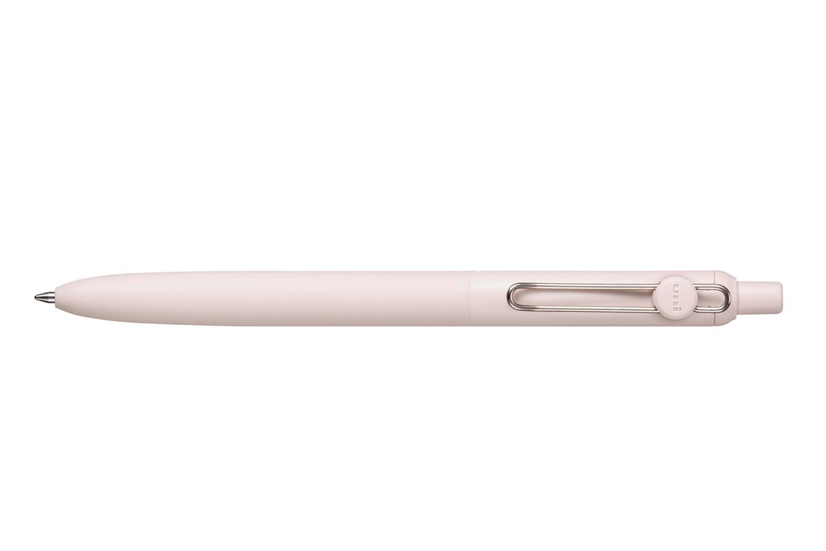 Pink pen with a silver clip on a white background