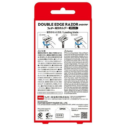 Double edge razor packaging with red and white design on a white background