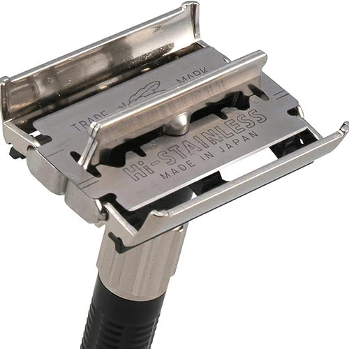 Metal safety razor with 'Made in Japan' text on a white background