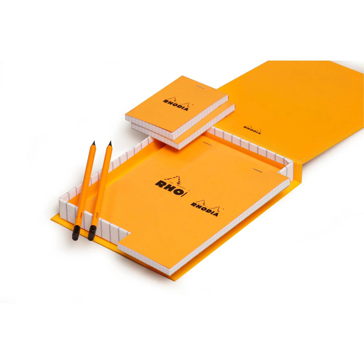 Orange Rhodia notebook set with two pencils on a white background