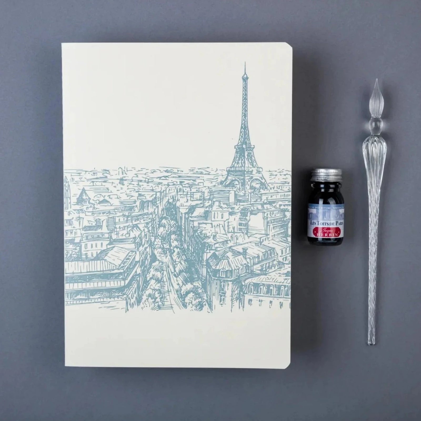 Notebook with Eiffel Tower illustration on a white background
