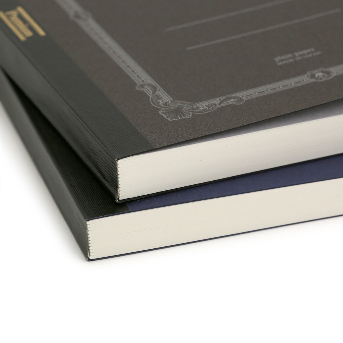 End view of spines for APICA CD premium notebooks showing the stitched sections and fabric taped spine
