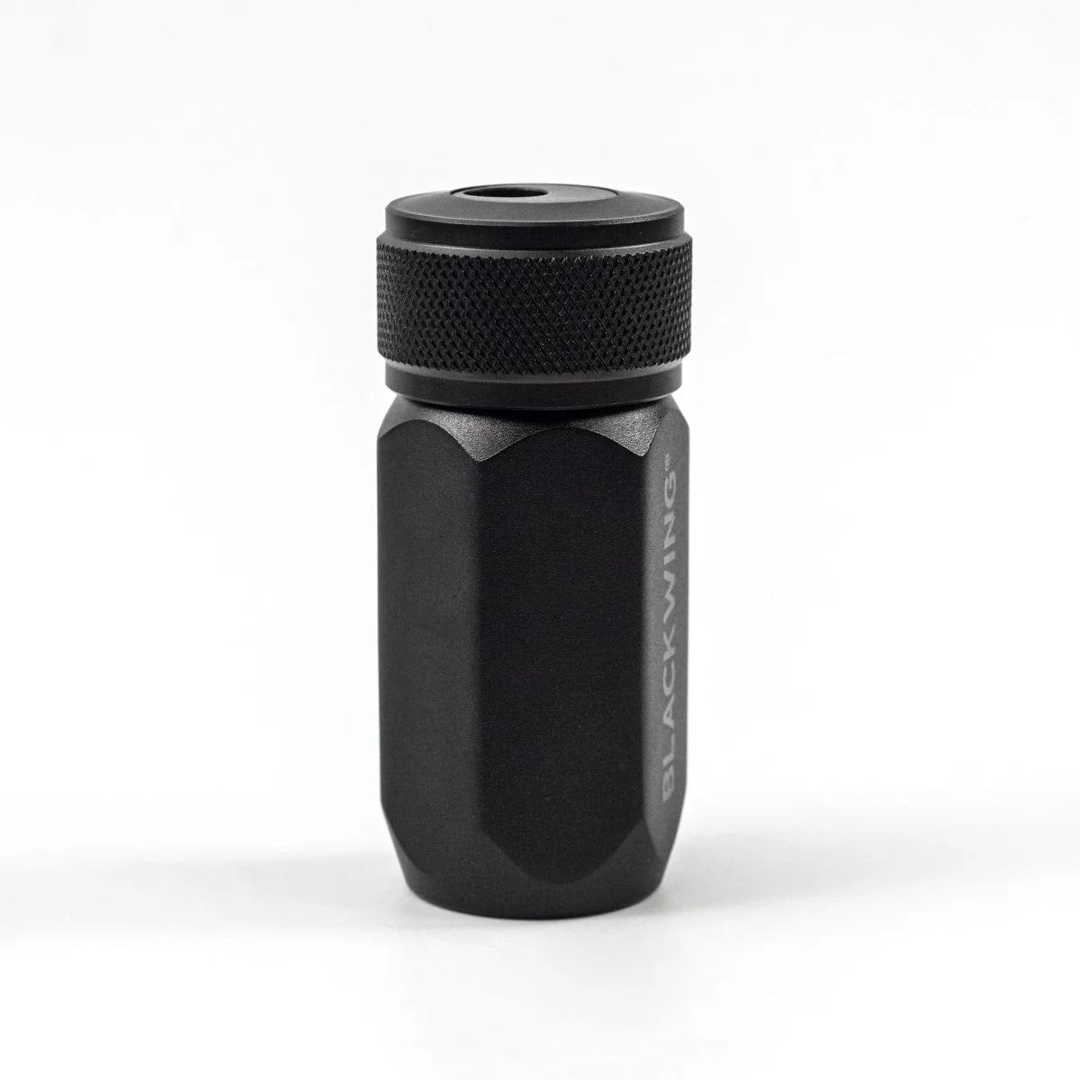 Black cylindrical pencil sharpener with 'BLACKWING' branding on a light grey background