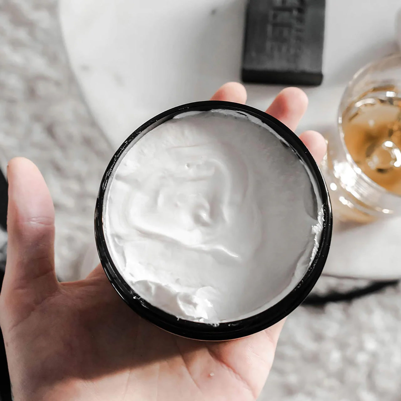 Beard Mask from Charles and Lee showing the black tub sitting on the black and white box