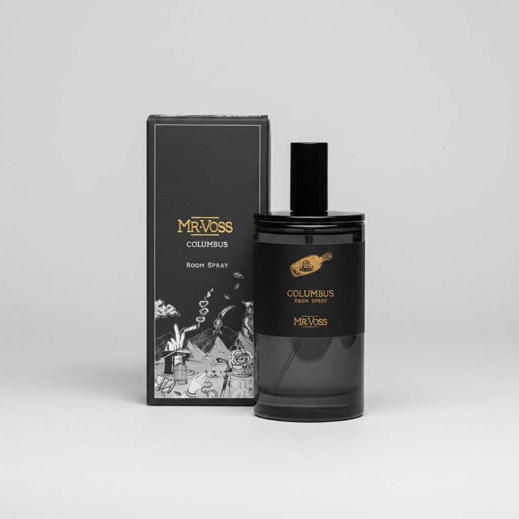Black perfume bottle and packaging with 'Columbus' branding on a white background