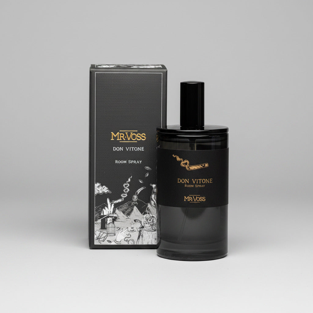 Black perfume bottle and packaging with 'Mr. Voss' branding on a white background