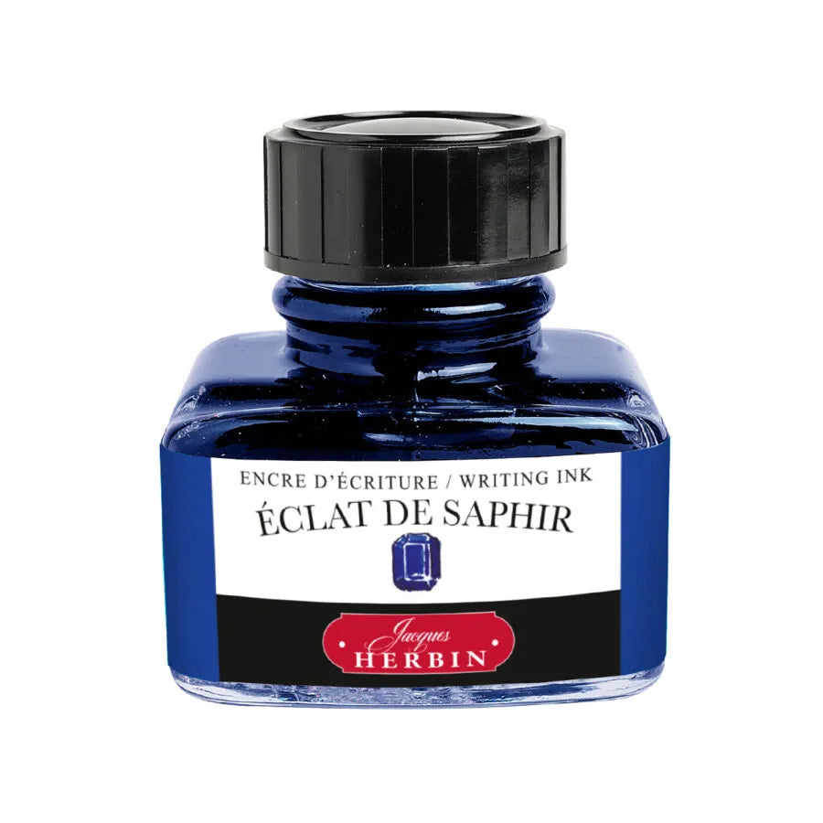 Ink bottle labeled &#39;Eclat de Saphir&#39; by Jacques Herbin on a white background