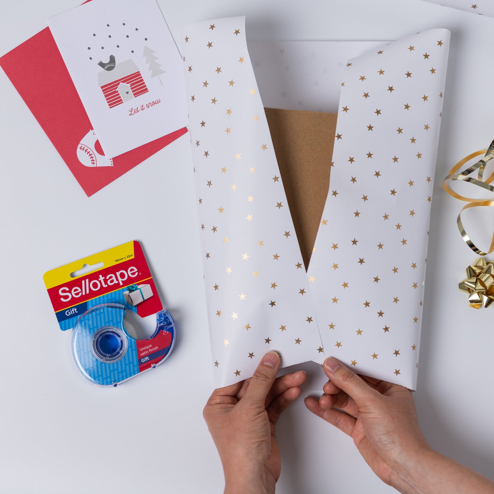 Sellotape packaging with two rolls of tape on a white background