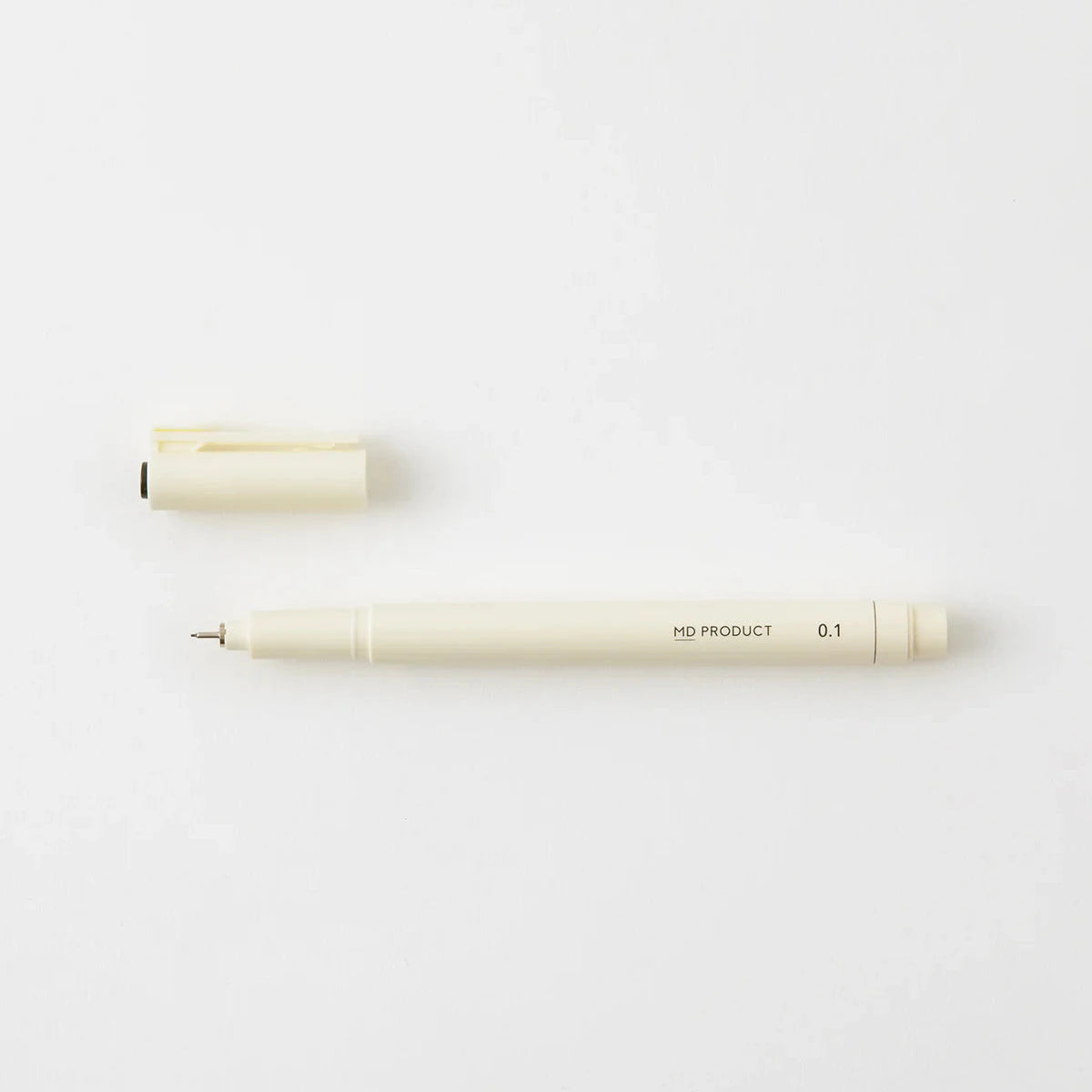 Two white pens on a light gray background