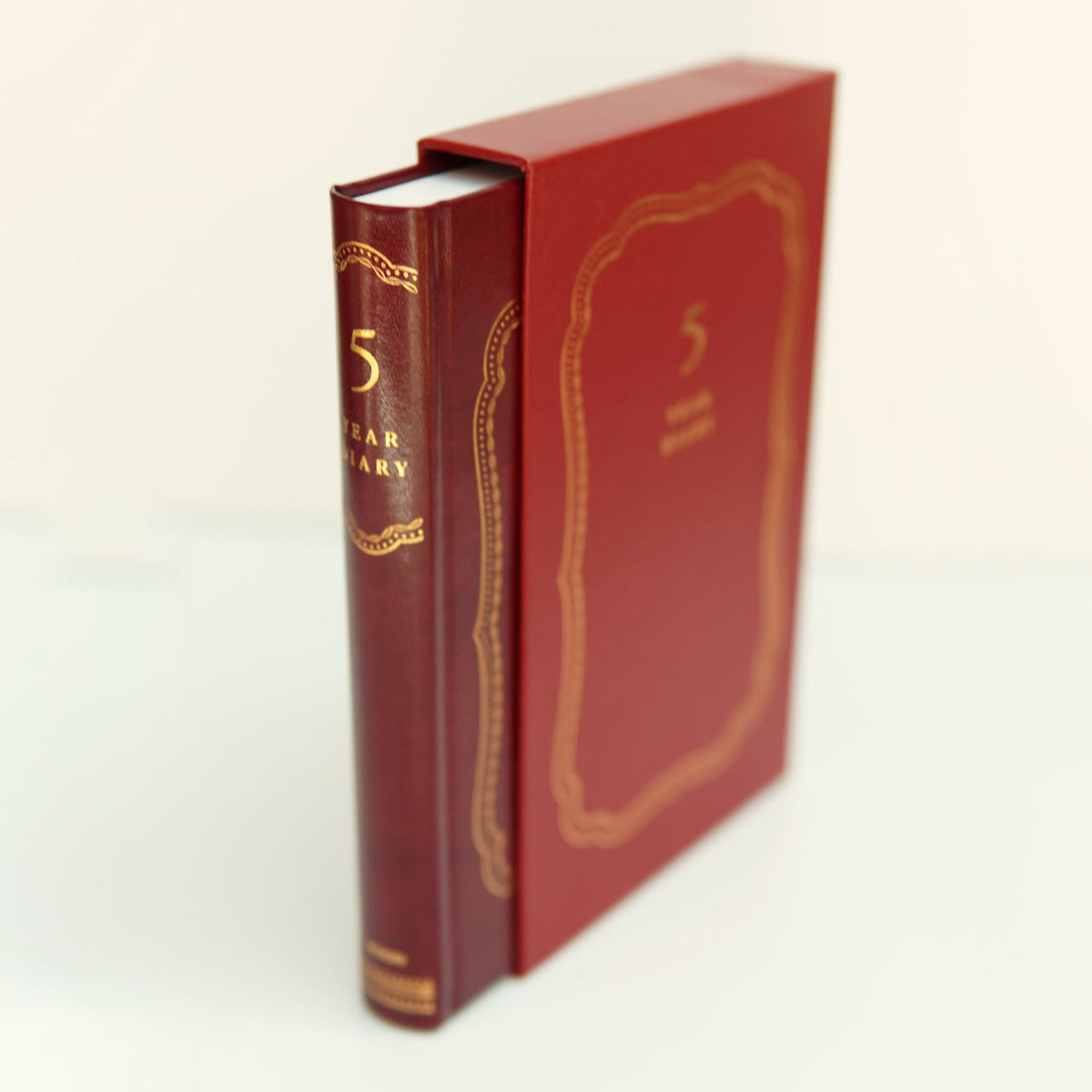 read leather 5 year diary in its red slip case