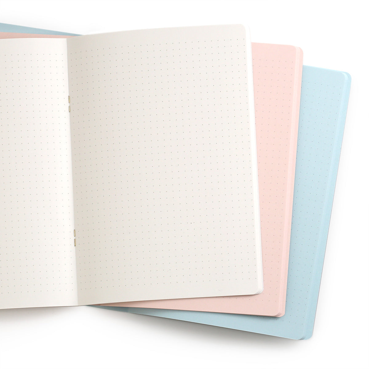 Midor dot grid notebooks open to show the cpages are coloured all through the book