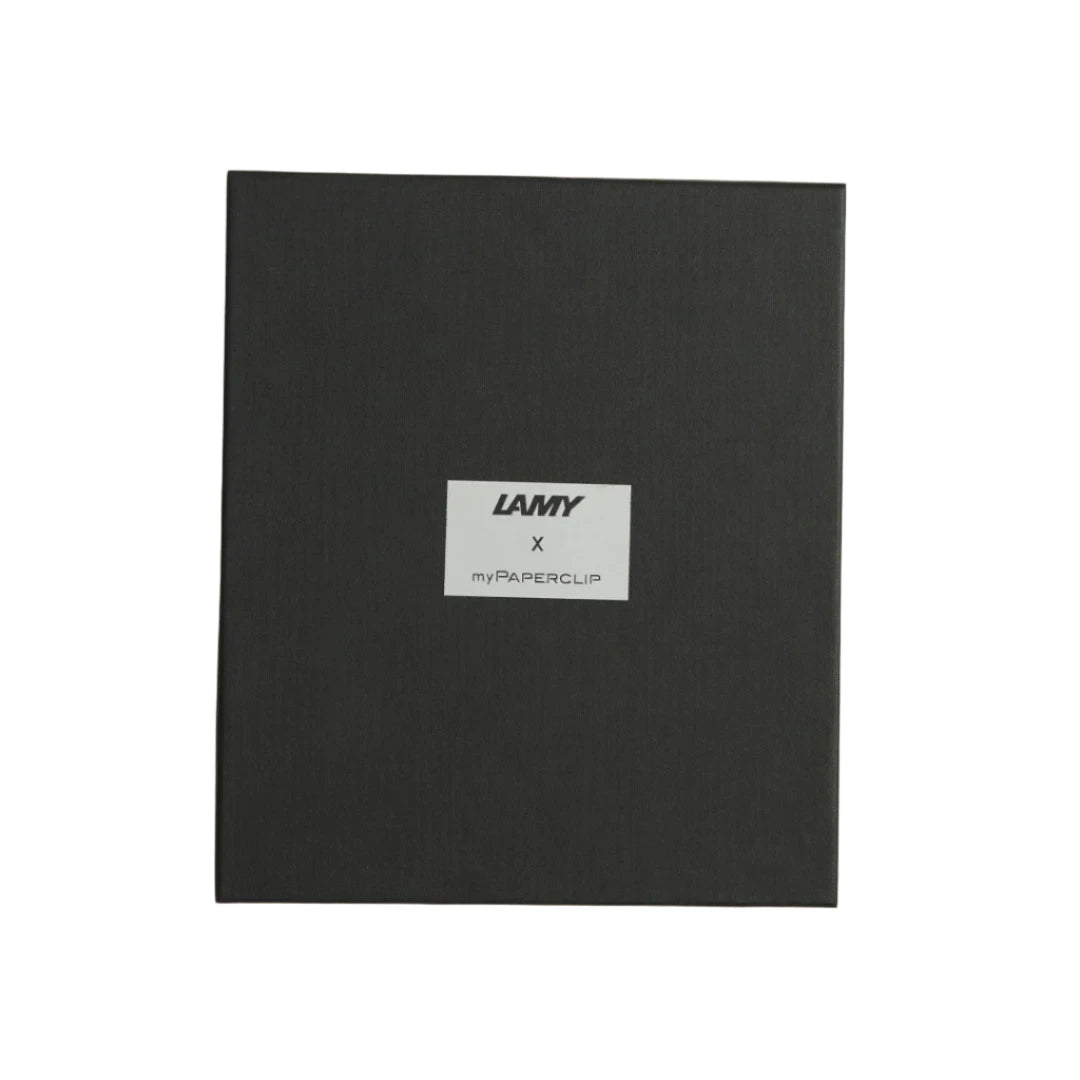 Outside of the black Lamy x MyPaperclip gift box with fabric covering and reflective foil logo panel