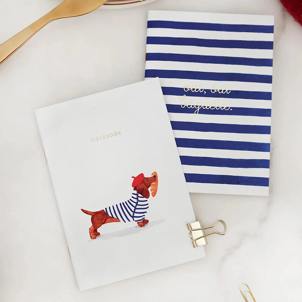 Napkin with striped pattern and dog illustration on a white surface