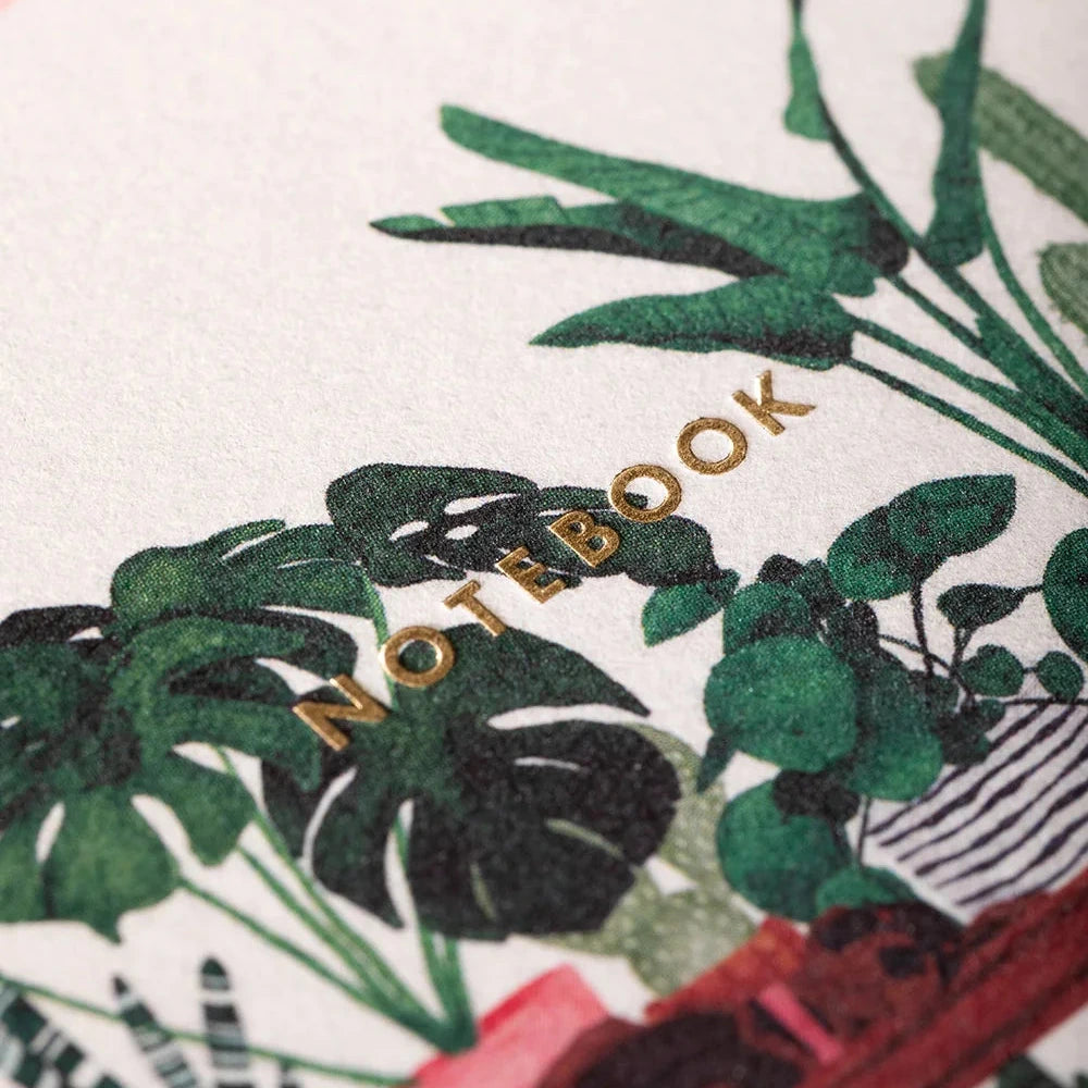Notebook with plant design and 'Notebook' text on a white background