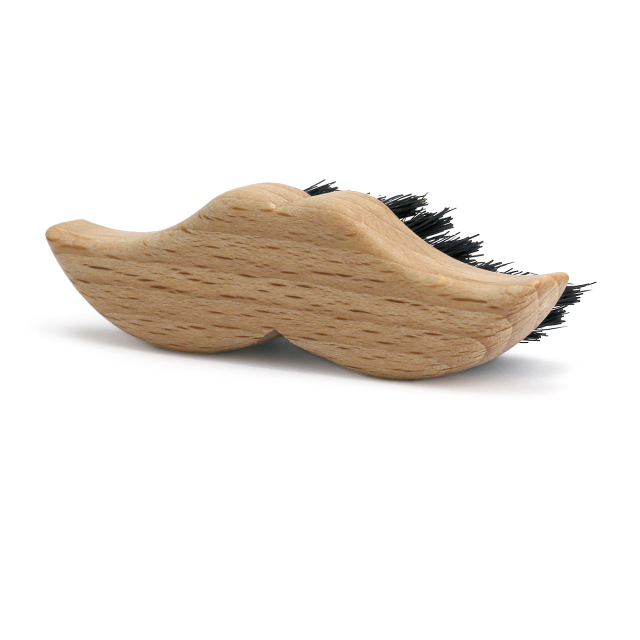 Redecker moustache brush - in the shape of a moustache - from germany . with a natural coloured timber and stiff bristles