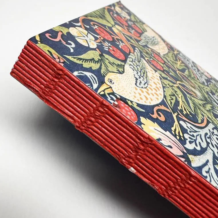 Stack of colorful cards with a bird design on a white background