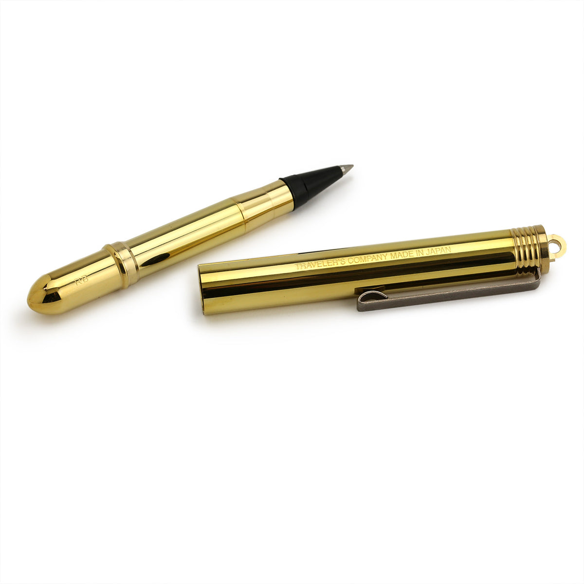 disassembled brass rollerball pen showing the pen end and the long cap which can be posted to make a regular length pen