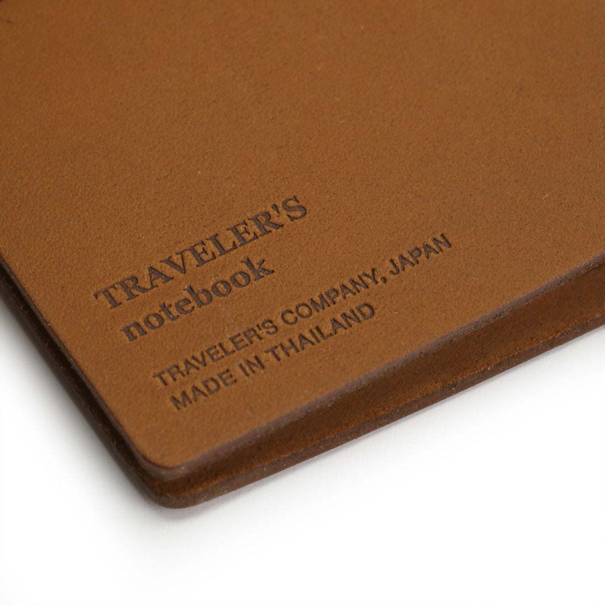 traveeler&#39;s company insignia stamped on the back of a camel notebook
