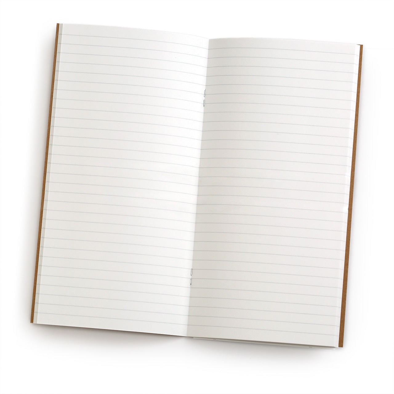 Traveler's notebook 001 lined MD paper refill, showing the kraft cover and the yellow label