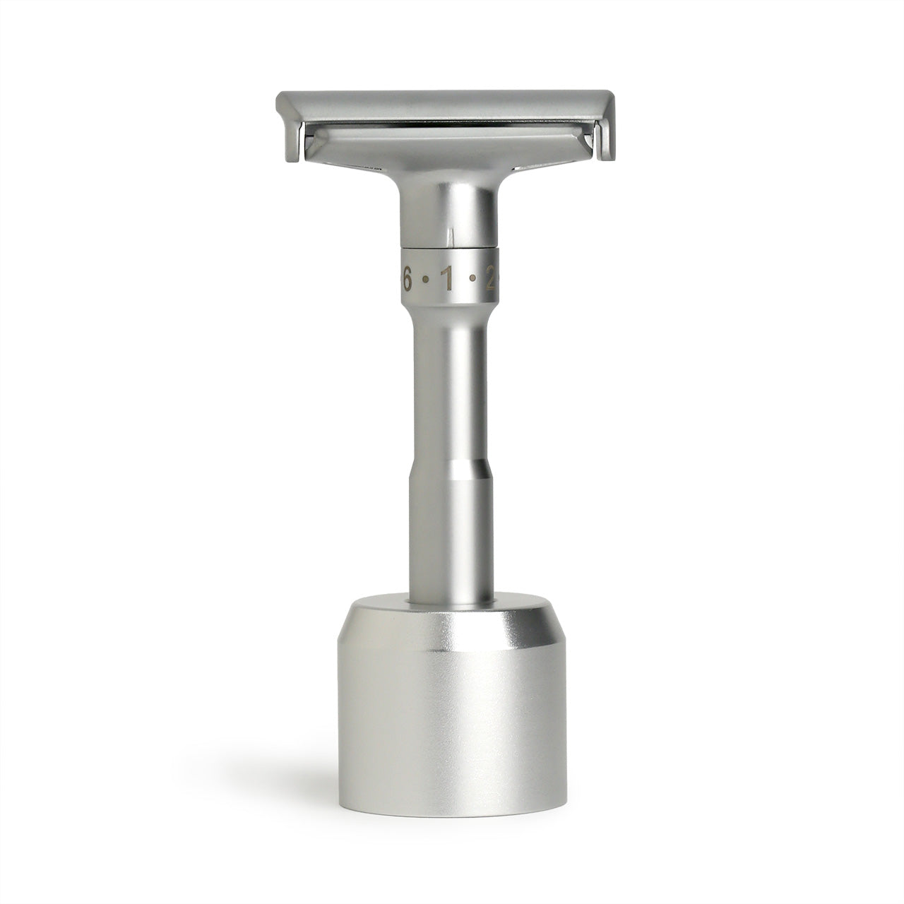 Adjustable Safety Razor stabding in its base, finished in matt chrome 